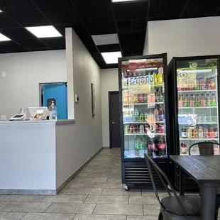 Front counter and fridge with drinks