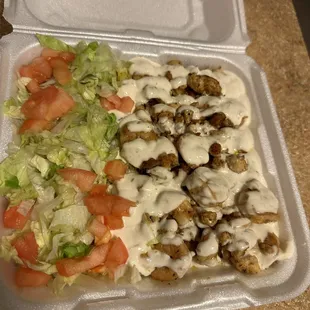 Chicken and shrimp with rice and salad