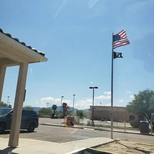 Flags outside of the post office and drive thru drop-off lane