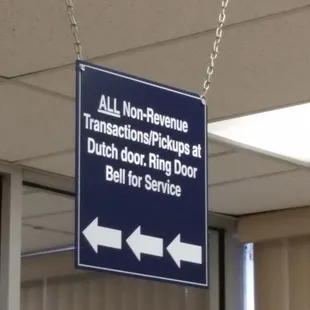 Sign pointing to Non-Revenue Transactions door