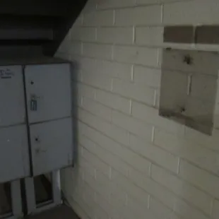 1st photo. Bare wall where the outgoing mail box used to be.