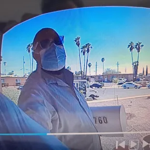 Broken mailbox in hand.