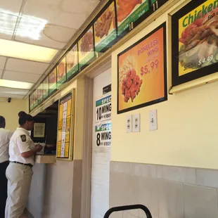 a man ordering food at a counter