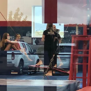 Coaches mingle long not helping kids work on skills.