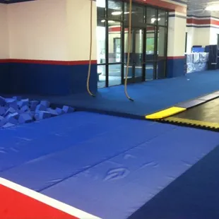 Our facility features 2 full spring floors, in-ground tumble track, 3 in-ground tramps, 2 foam pits &amp; full gymnastics training equipment!