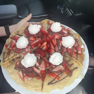 Awesome Nutella/strawberry crepes w/ buttercream whipped cream