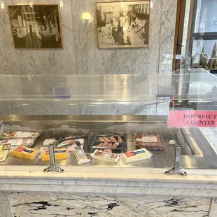 a counter with a variety of food items