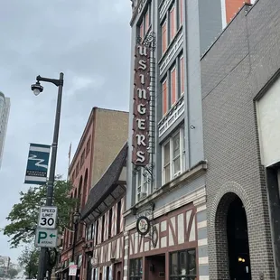 a red fire hydrant in front of a building