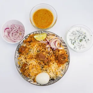 100% Authentic Hyderabadi Chicken Dum Biryani. Salan and Raita.