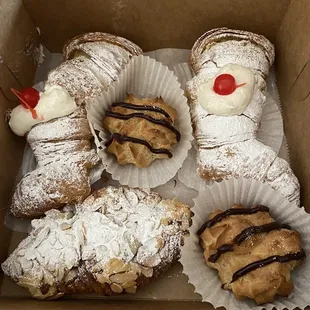 2 lobster tails with fresh cream, 2 hazelnut mini puffs, and an almond croissant