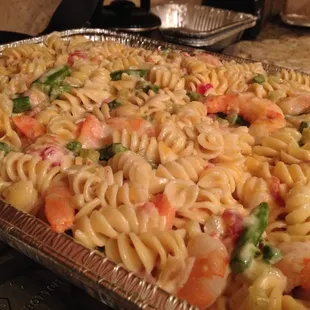 Pasta, jumbo shrimp, asparagus, tomatoes and creamy Alfredo sauce