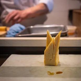 a chef preparing food in a kitchen