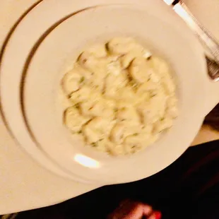 a bowl of pasta on a white plate
