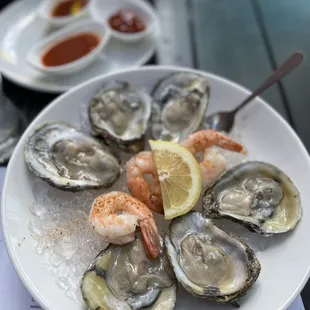 Oysters and a few chilled shrimp during $2 oyster and shrimp happy hour!