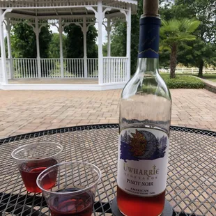 a glass of wine and a bottle of wine