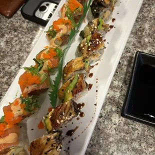 a long plate of sushi