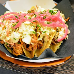 Tacos - Crunchy corn tacos, pulled pork, house slaw, pickled red onion