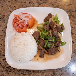 a plate of food with rice and vegetables