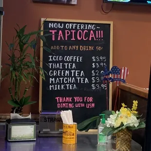 a menu and a price board