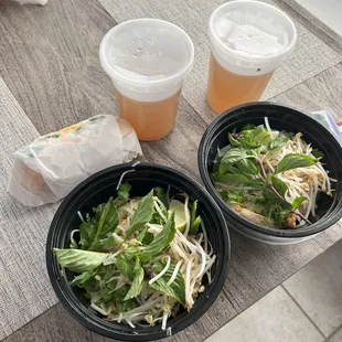 two bowls of salad and drinks
