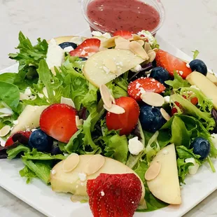 Very Berry Salad: spring mix, strawberries, blueberries, apple, blue cheese/feta, roasted almonds, raspberry-walnut vinaigrette