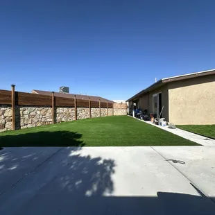 a backyard with artificial grass