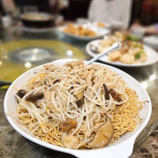 a plate of noodles with mushrooms and mushrooms