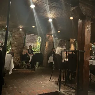 people sitting at tables in a restaurant