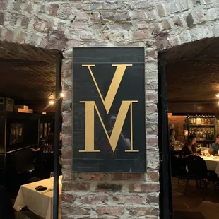 a restaurant with a brick wall