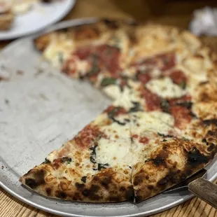 a half eaten pizza on a plate