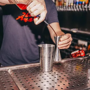 a bartender mixing a drink
