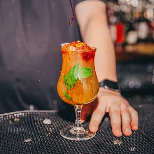 a bartender making a cocktail