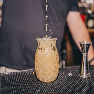 a bartender making a drink