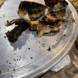 The entire crust burnt, waitress did not care said it was open fire pizza so that's to be expected.... Ok...