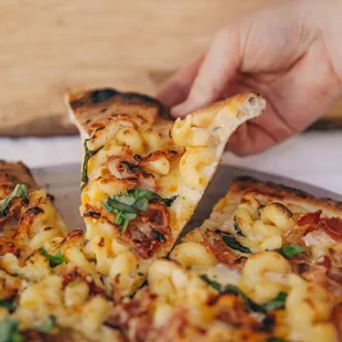 MAC ATTACK PIZZA :
Mozzarella, V pesto mac-n-cheese, pancetta, homemade cheese sauce, fresh basil. 
NOTE: Noodles are not GF