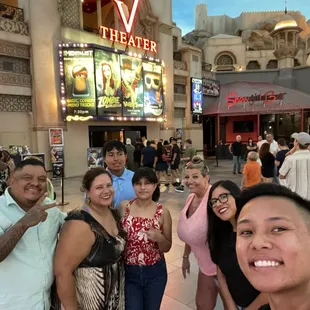 Group photo in front of the V theater, There were  eight people in our party