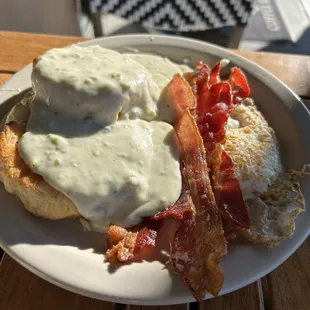 Biscuits and gravy with crispy bacon and a fried egg... Reasonably priced and delicious.