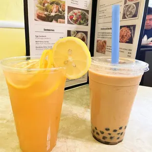two drinks on a table with a menu in the background
