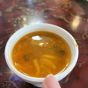 Little sample cup of chicken soup