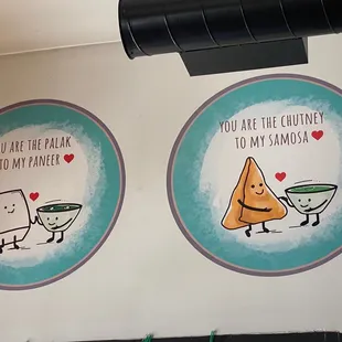 two plates of food on a wall