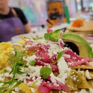 A big favorite, Chilaquiles adding one of our ridiculously delicious proteins.