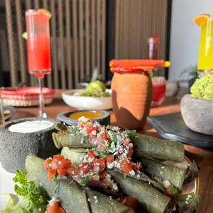 Blue Corn Birria Taquitos. Flavorful shareble and they go well with any of our drinks. Awesome food, Awseom drinks