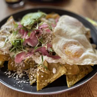 Chilaquiles salsa verdes y huevos estrellados added avocado. Delicious.