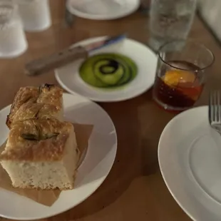 Focaccia and fresh pressed olive oil with a Negroni!!!