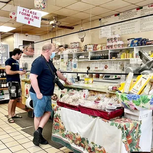 a man standing in a grocery store