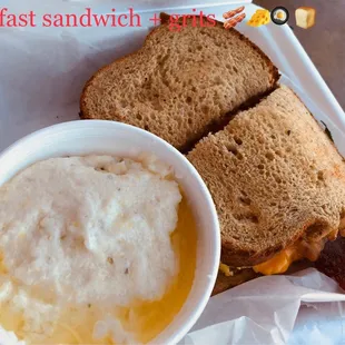 Breakfast sandwich (wheat bread, scrambled eggs, bacon, cheddar) comes with a side of creamy grits