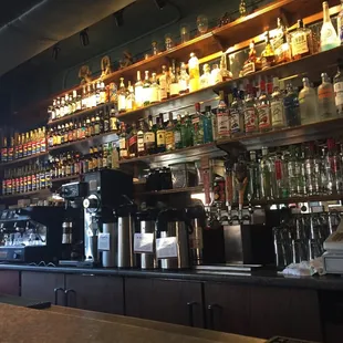 a bar with a variety of liquors