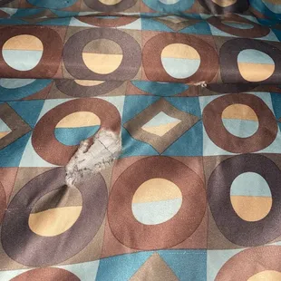 Some type of hole in the other bed sheet