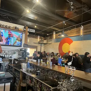 a crowd of people at the bar