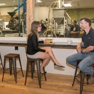 Sit and enjoy a cup while watching your coffee get roasted